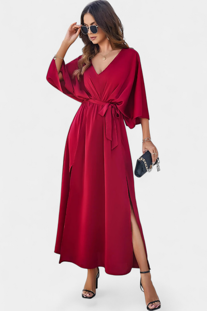 Milly Abito elegante con fiocco e spacco
