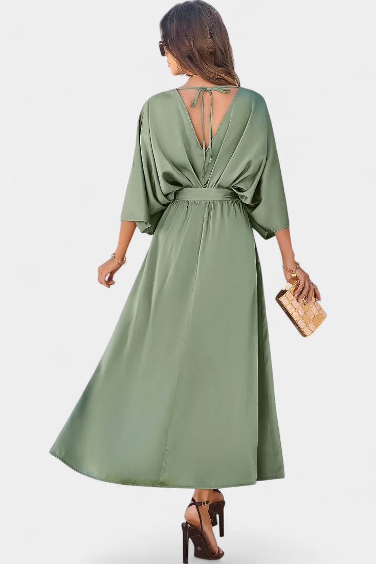 Milly Abito elegante con fiocco e spacco